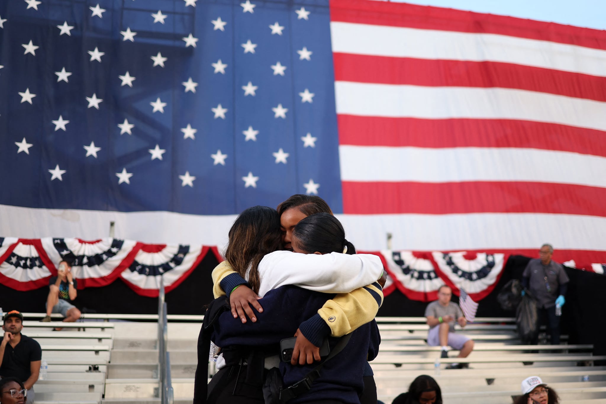 Young Gen Z women hug after the election results of the 2024 presidential race are announced
