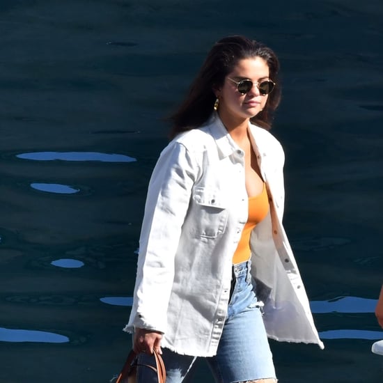 Selena Gomez in Orange Bodysuit and Denim Shorts in Italy