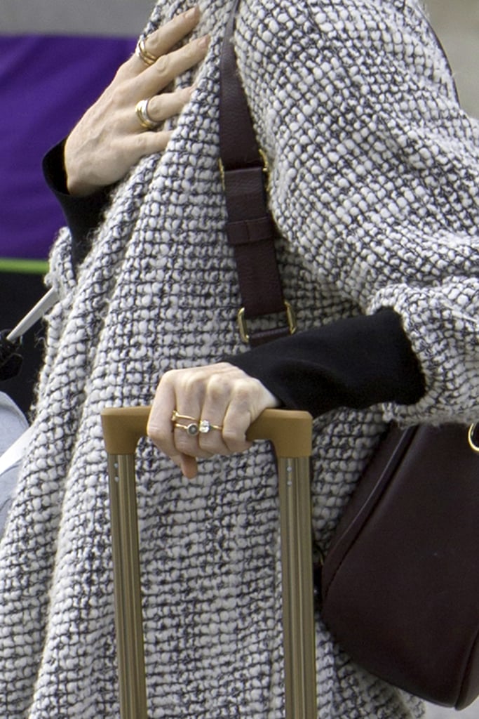 She Was Wearing a Round-Cut Diamond Ring With a Gold Band