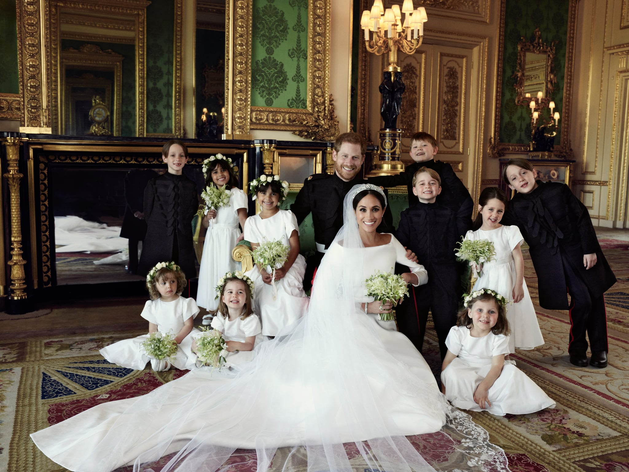 WINDSOR, UNITED KINGDOM - MAY 19: In this handout image released by the Duke and Duchess of Sussex, the Duke and Duchess of Sussex pose for an official wedding photograph with (left-to-right): Back row: Master Brian Mulroney, Miss Remi Litt, Miss Rylan Litt, Master Jasper Dyer, Prince George, Miss Ivy Mulroney, Master John Mulroney. Front row: Miss Zalie Warren, Princess Charlotte, Miss Florence van Cutsem in The Green Drawing Room at Windsor Castle on May 19, 2018 in Windsor, England. (Photo by Alexi Lubomirski/The Duke and Duchess of Sussex via Getty Images) NEWS EDITORIAL USE ONLY.  NO COMMERCIAL USE. NO MERCHANDISING, ADVERTISING, SOUVENIRS, MEMORABILIA or COLOURABLY SIMILAR. NOT FOR USE AFTER 31 DECEMBER 2018 WITHOUT PRIOR PERMISSION FROM KENSINGTON PALACE. NO CROPPING. Copyright in the photograph is vested in The Duke and Duchess of Sussex. Publications are asked to credit the photograph to Alexi Lubomirski. No charge should be made for the supply, release or publication of the photograph. The photograph must not be digitally enhanced, manipulated or modified in any manner or form and must include all of the individuals in the photograph when published.