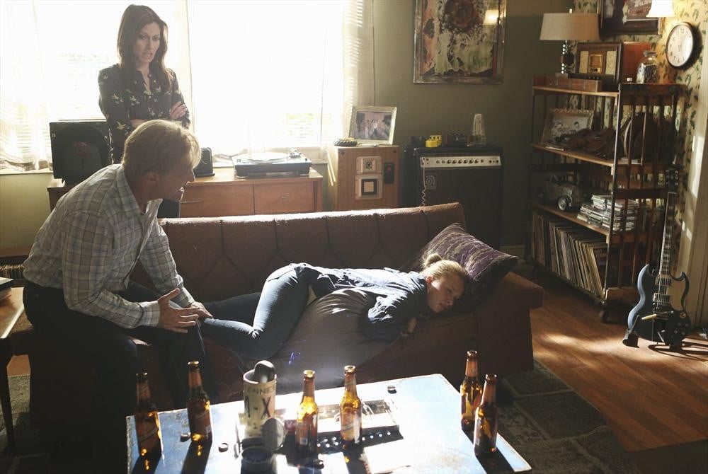 Emily (Kourtney Hansen) and Glenn (Ed Amatrudo) come to her side.