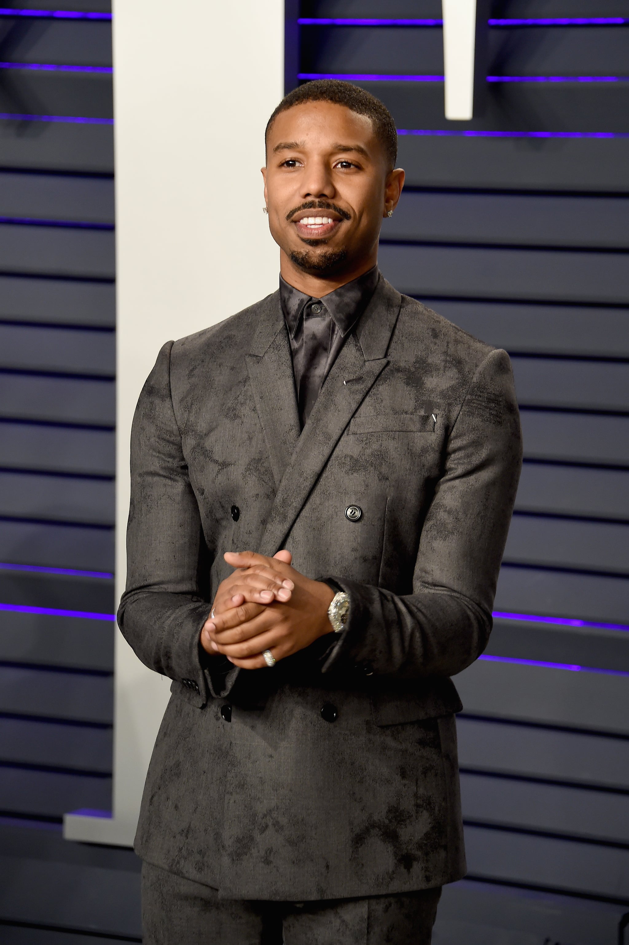 Versace - Michael B Jordan wears a look from the #VersaceCruise20  Collection for his appearance on The Tonight Show. The actor chose a  tailored suit boasting a pinstripe pattern enriched with subtle