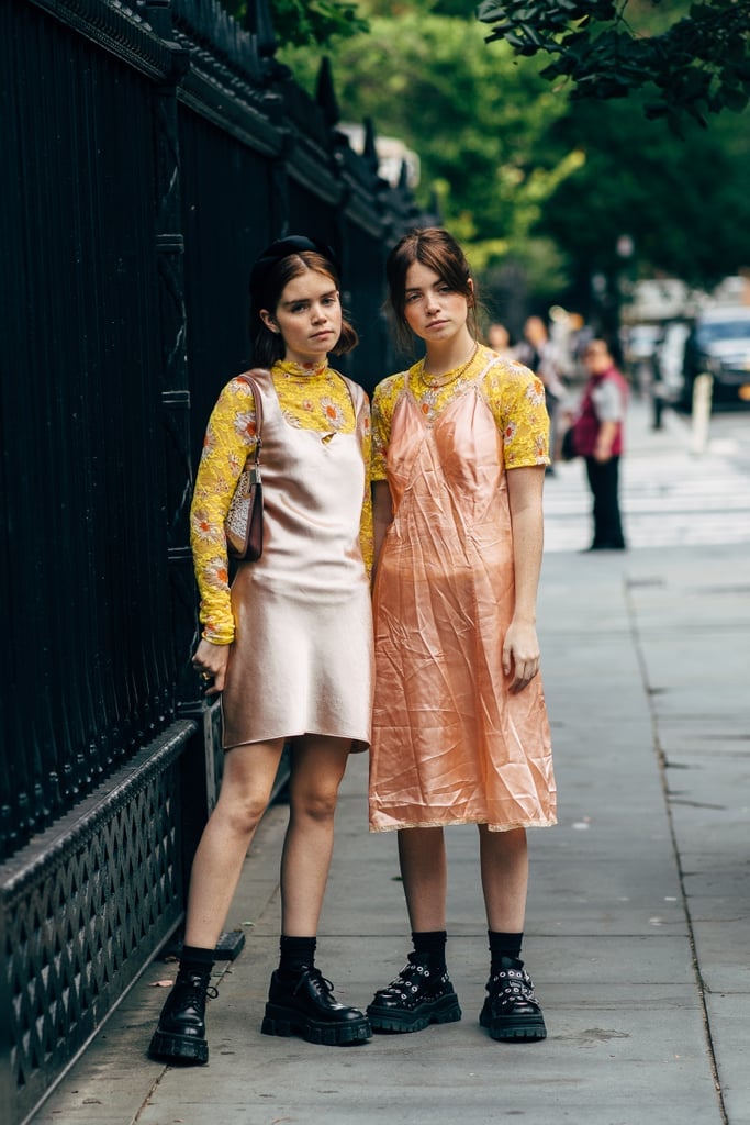 Layer up with a slip dress and tee, grounding the boudoir-inspired look with a pair of chunky-soled boots.