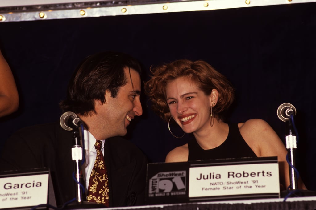 Julia giggled with Andy Garcia at the Showest Convention in 1991.
