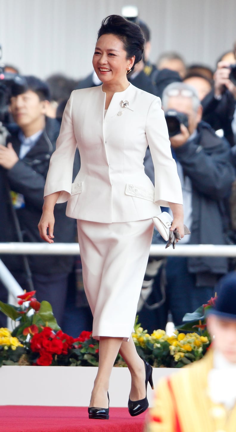 Her White Suit Is a Step Above the Rest With Its Subtle Bell Sleeves