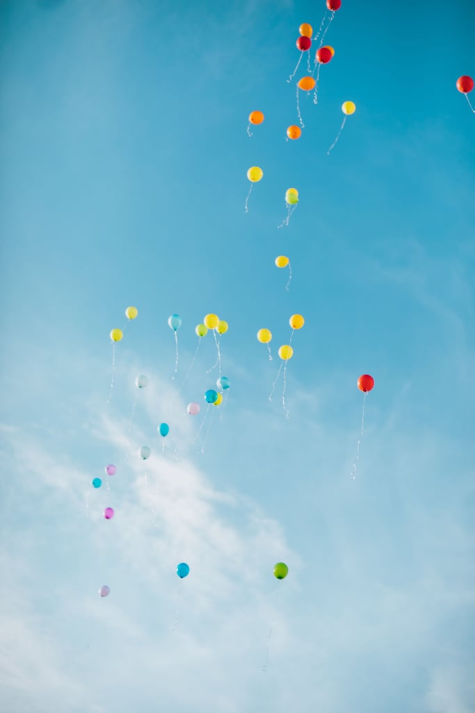 They watched as their balloons drifted up, up, up. And away.