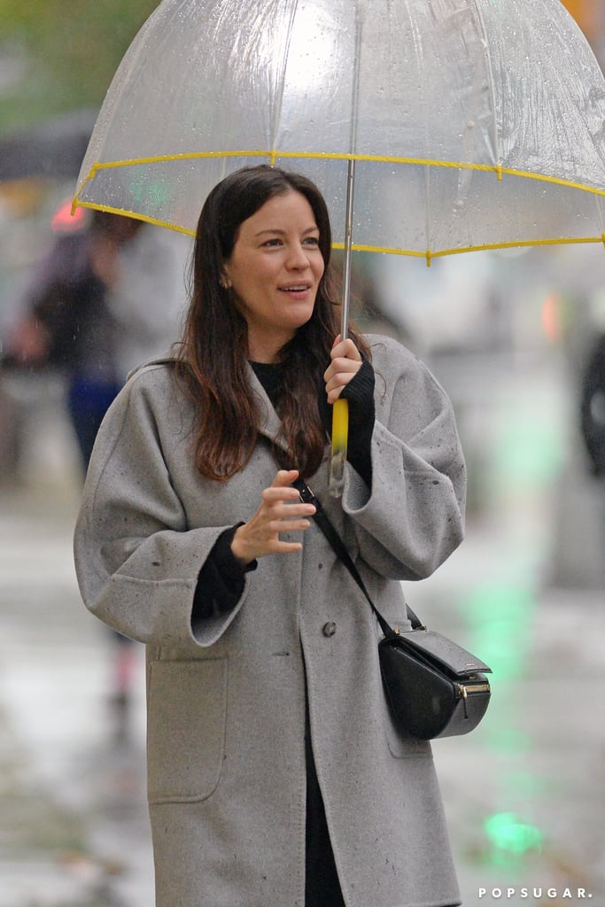 Liv Tyler didn't let the rain dampen her happiness in NYC on Wednesday.