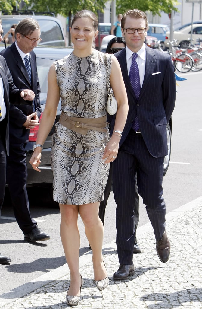 Crown Princess Victoria of Sweden wearing a snakeskin outfit.