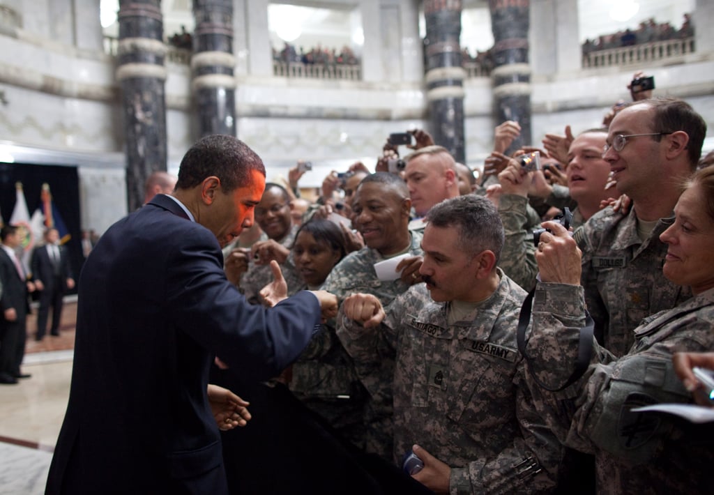 Fist bumping a US solider at Camp Victory in Baghdad, marking himself as the coolest president yet.