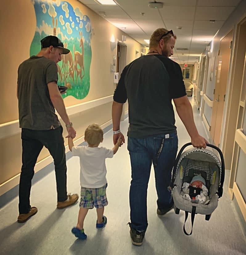 Photo of Dad and Stepdad Holding Boys Hands at Hospital POPSUGAR Family pic Photo of Dad and Stepdad Holding Boys Hands at Hospital POPSUGAR Family photo
