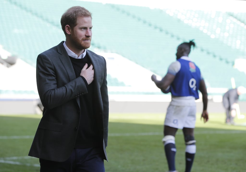 For a day spent with the England rugby team, Harry opted for a black jumper, which he wore underneath a smart blazer.
