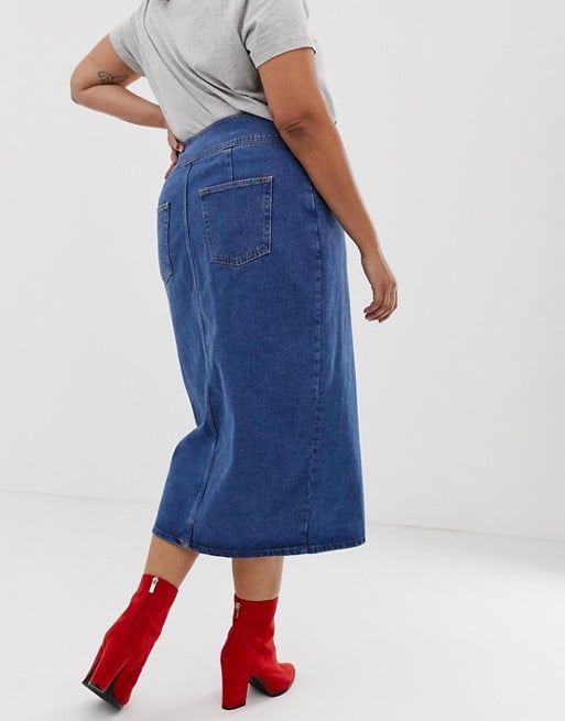 ASOS DESIGN Curve denim midi skirt with poppers in midwash blue