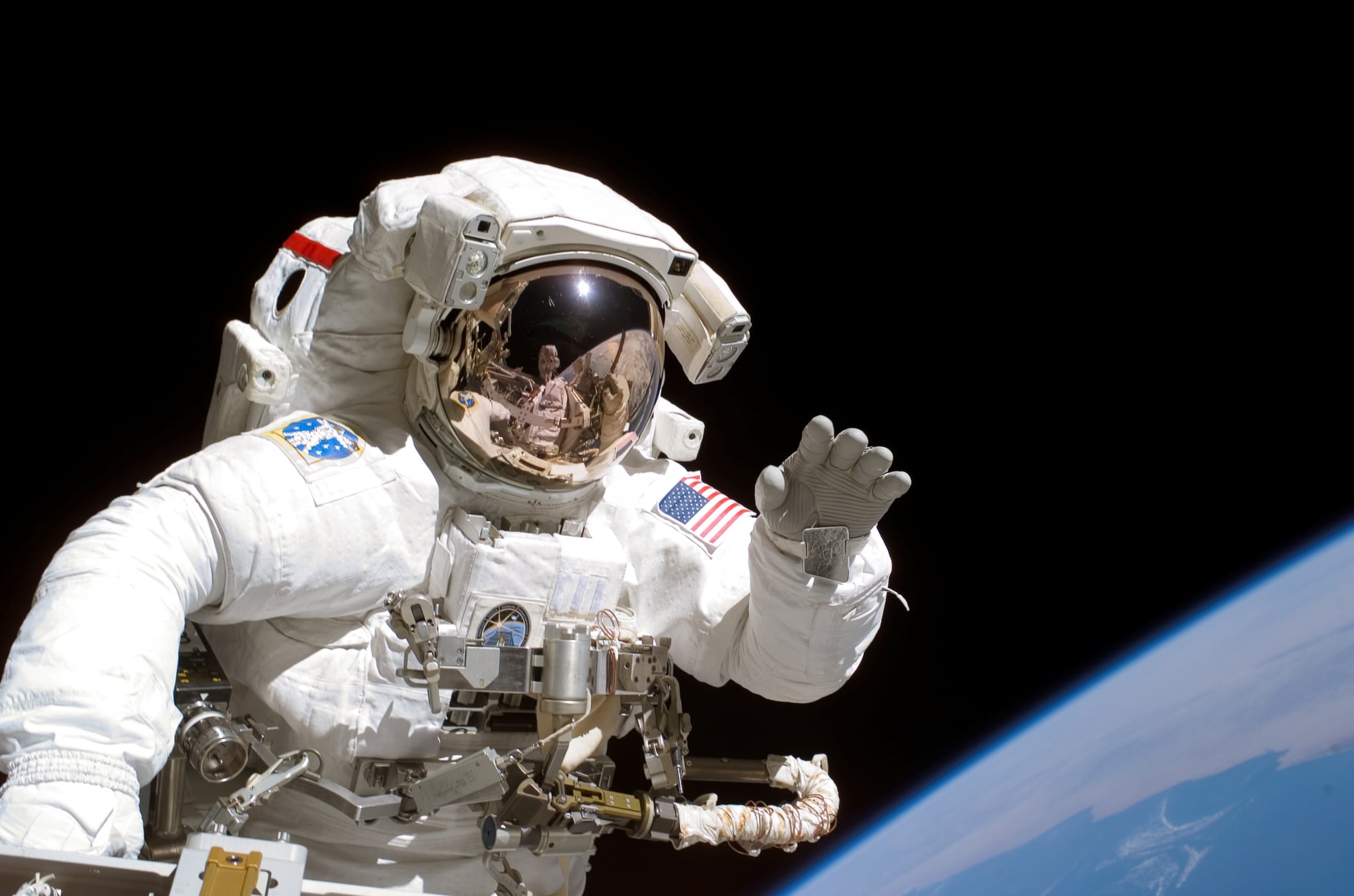 American astronaut Joseph Tanner waves to the camera during a space walk as part of the STS-115 mission to the International Space Station, September 2006. (Photo by NASA/Getty Images)