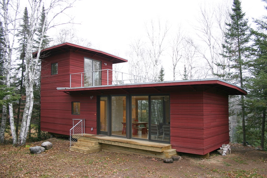 The McGlasson weeHouse boasts a rooftop deck, gorgeous forest views, and a price far below $200,000 — talk about a dream home! The gorgeous red exterior is just the start of this tiny dwelling's beautiful features; it also includes a modern kitchen, huge windows, and panoramic views of evergreen trees from its back deck. The McGlasson weeHouse boasts a rooftop deck, gorgeous forest views, and a price far below $200,000 — talk about a dream home! The gorgeous red exterior is just the start of this tiny dwelling's beautiful features; it also includes a modern kitchen, huge windows, and panoramic views of evergreen trees from its back deck.