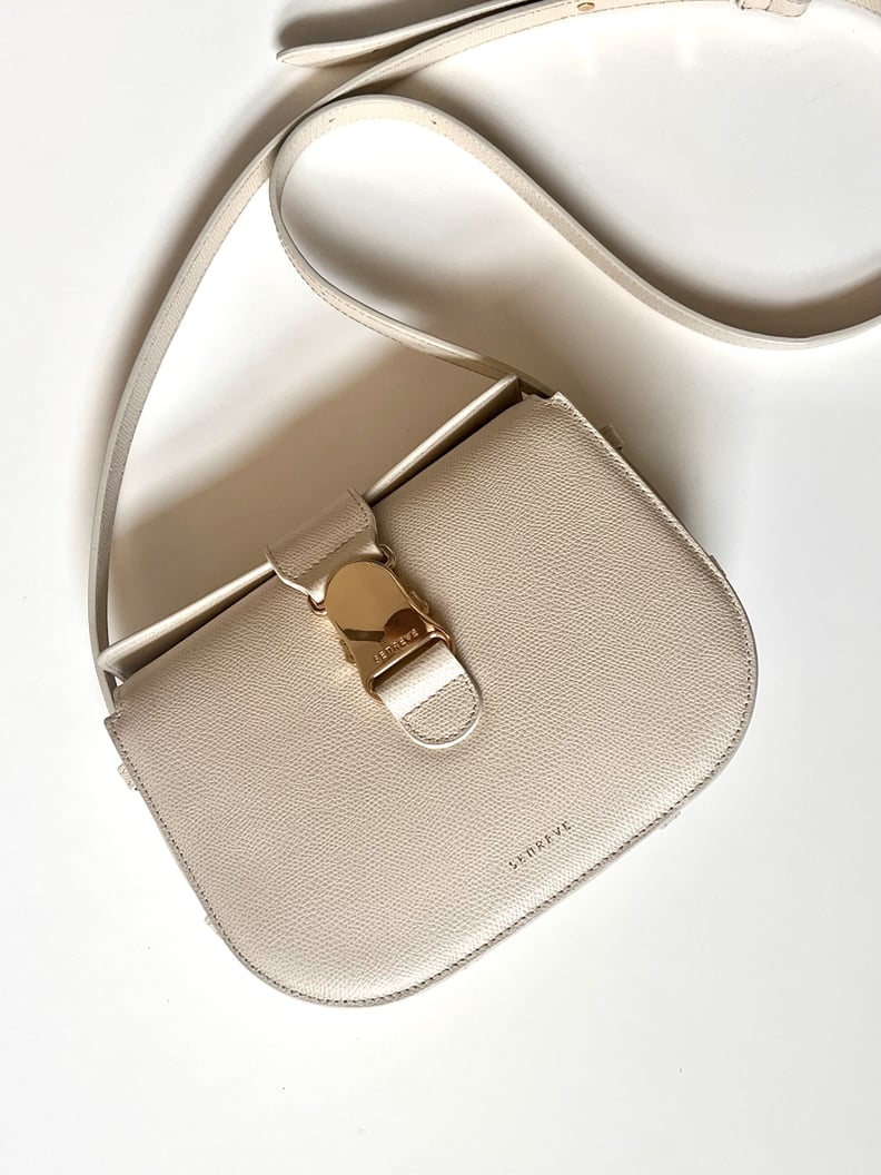 The Senreve Cadence Crossbody in cream pebble leather.