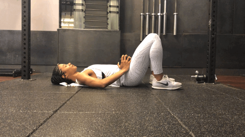 GIF demonstration of a weighted glute bridge