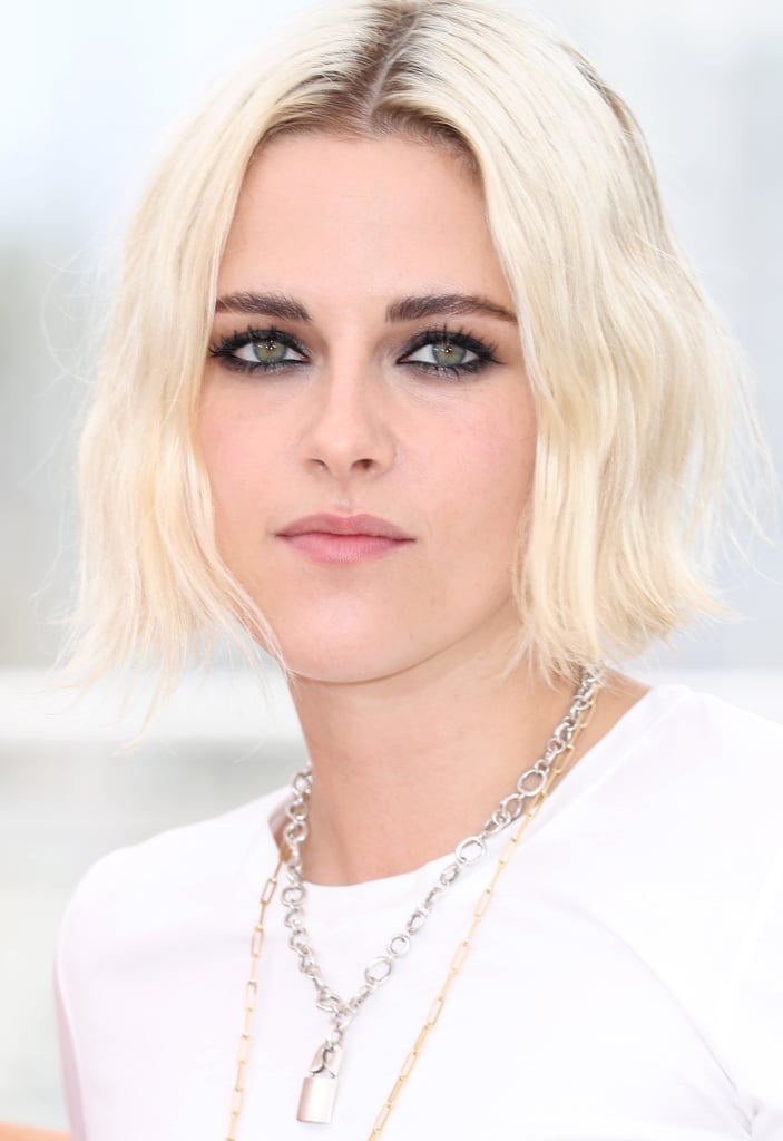 Kristen Stewart's bleach-blond hair was parted in the middle and paired with a dramatic smoky eye at her Café Society photocall.