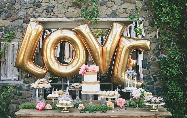 If there's one easy way to add some whimsy and color to your wedding, it's with balloons. Whether you're using standard, helium, or weather balloons, they are inexpensive and bring a visual punch to your big day. The key is to keep it sophisticated while embracing their innate sense of fun. Check out POPSUGAR Home's picks of the most perfect wedding balloons.
Photo by onelove photography via Green Wedding Shoes