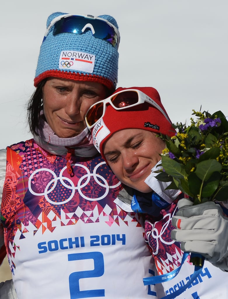 Norway's Marit Bjoergen and Heidi Weng hugged and cried after taking home the gold and bronze medals for the women's 15-kilometer skiathlon.