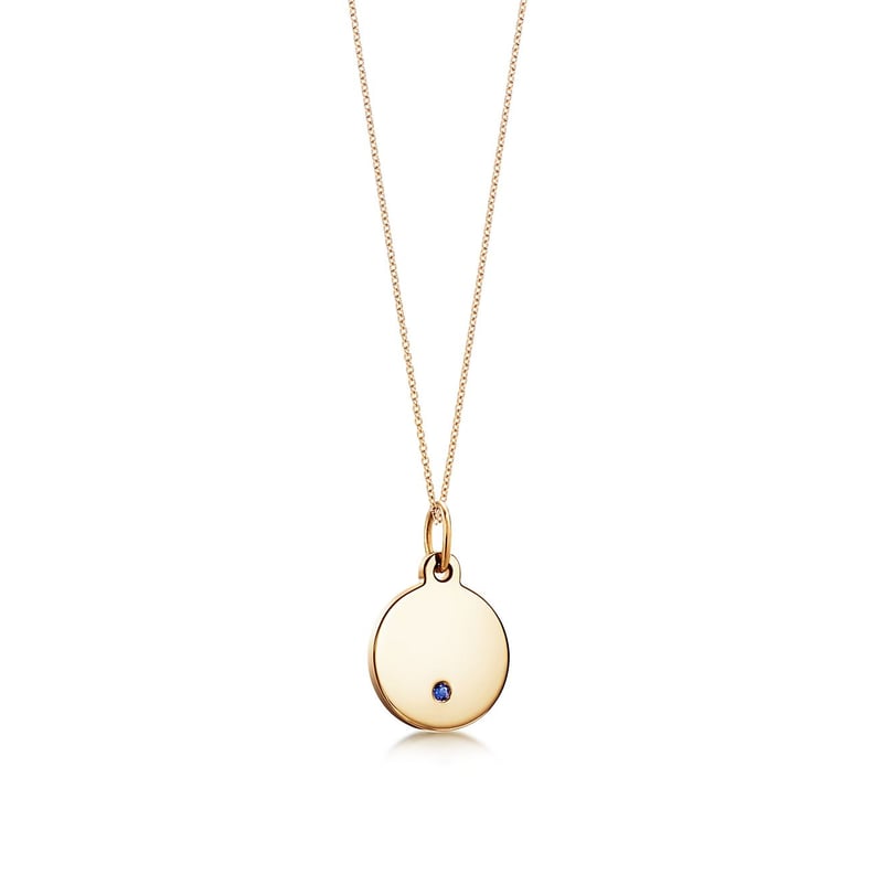Tiffany Charms Round Tag in 18k Gold With Sapphire