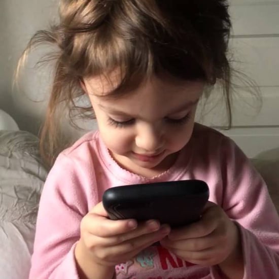 Toddler Talking to iPhone's Siri