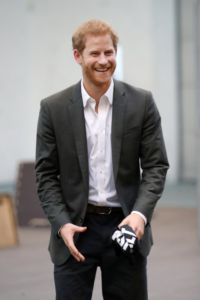 During a visit to Denmark, Prince Harry wore a grey blazer, white shirt, and black trousers.