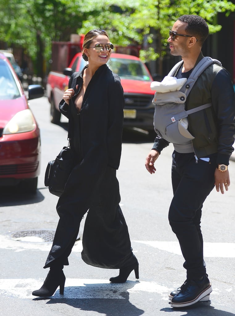 John and Chrissy were all smiles while walking with Luna in NYC in May.