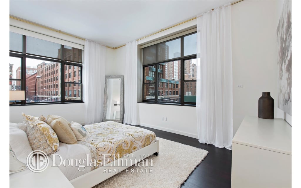 The corner bedroom features a great view and large walk-in closet.