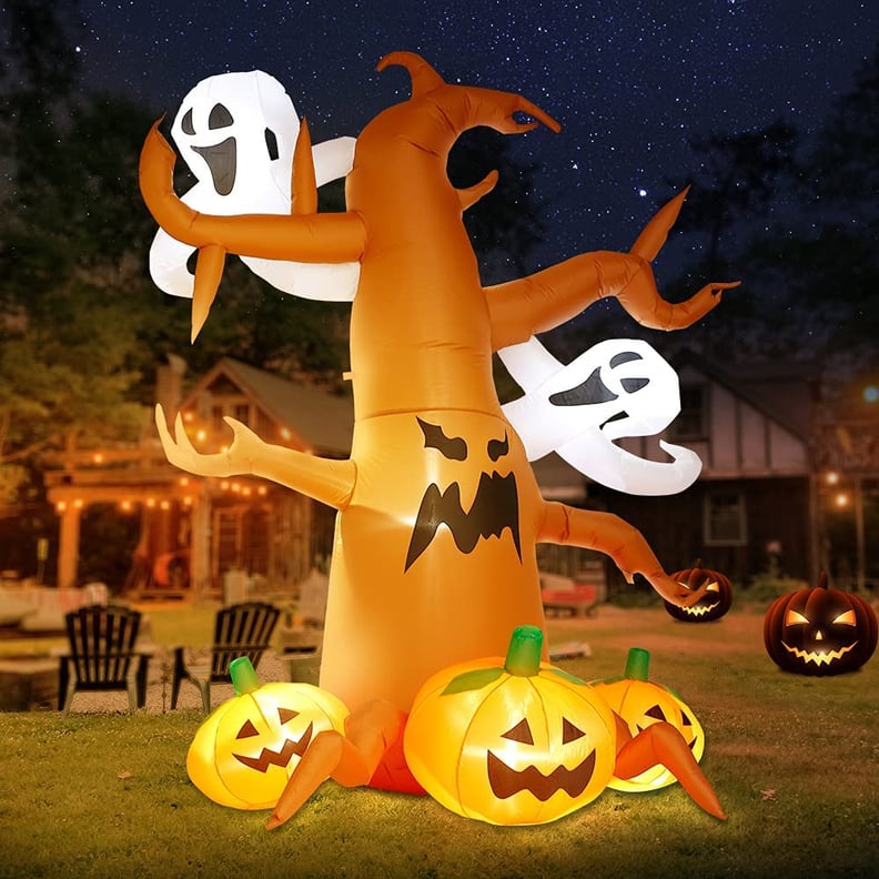 A Haunting Nature-Scape: Inflatable Spooky Tree with Ghost and Pumpkins