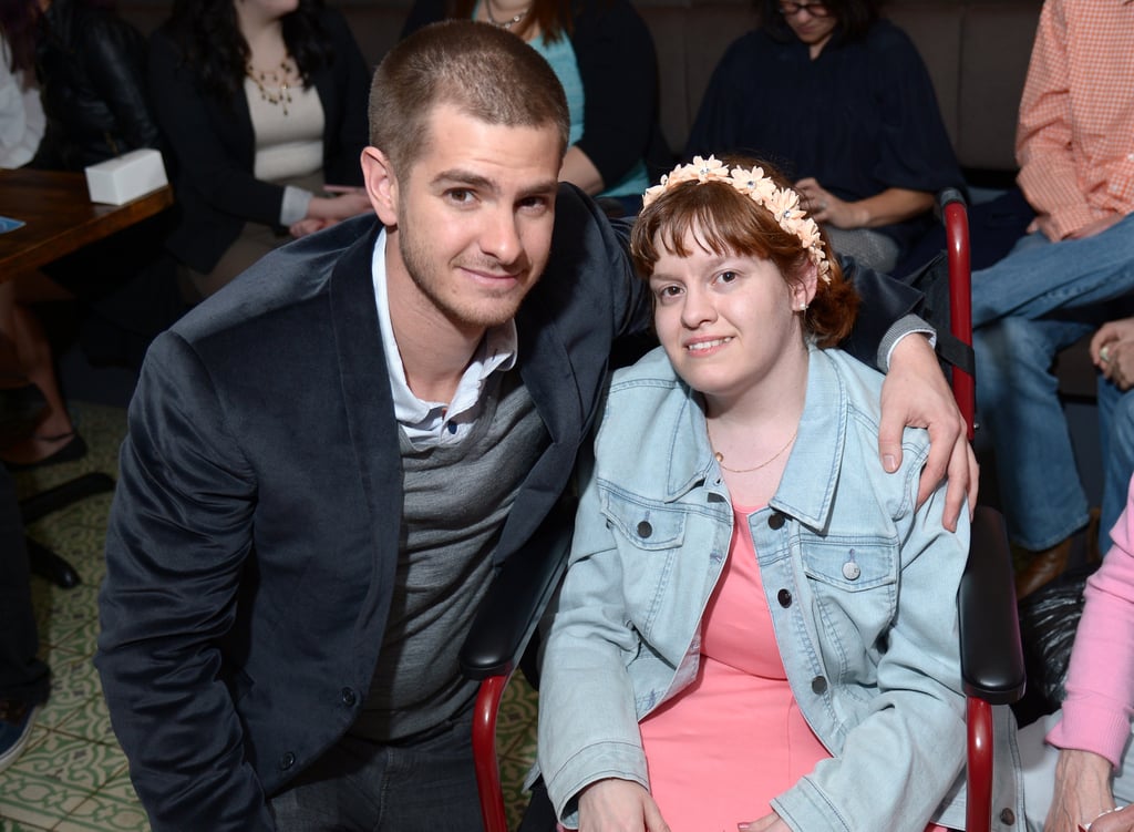 He posed with a young girl at the WWO Host Salon event in NYC in April 2014.