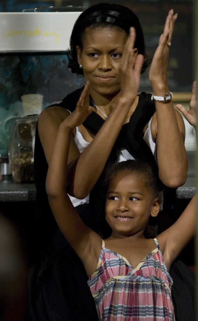 Michelle and Sasha, then 6, listened to Barack give a speech at Smokey Row Coffee in Iowa in 2007.