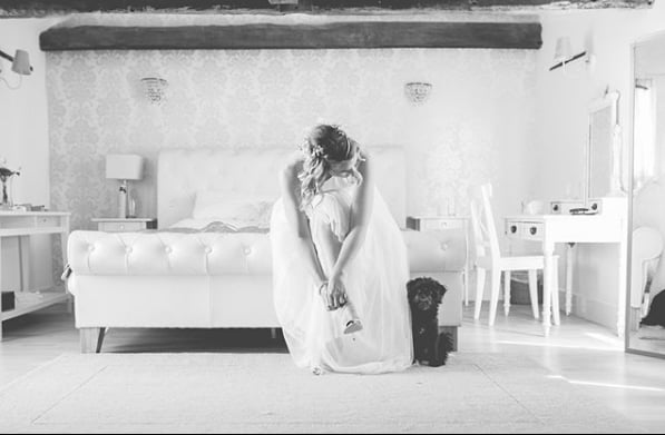 What's that behind the bride? Just her furry friend!