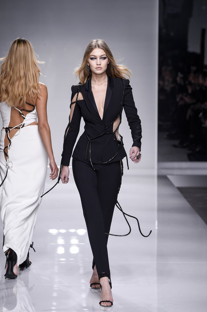 Wearing a Swarovski rope-lined cutout Versace Couture suit for the fashion house's Spring '16 Couture show.