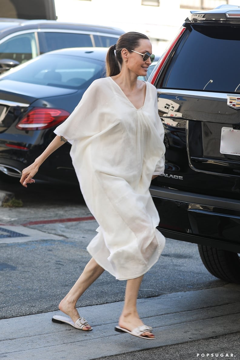 Angelina Jolie Wearing a White Dress and Matching Slides