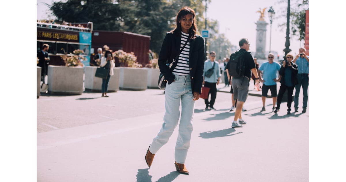 Loose-fitting jeans and cowboy boots give a striped top a 
