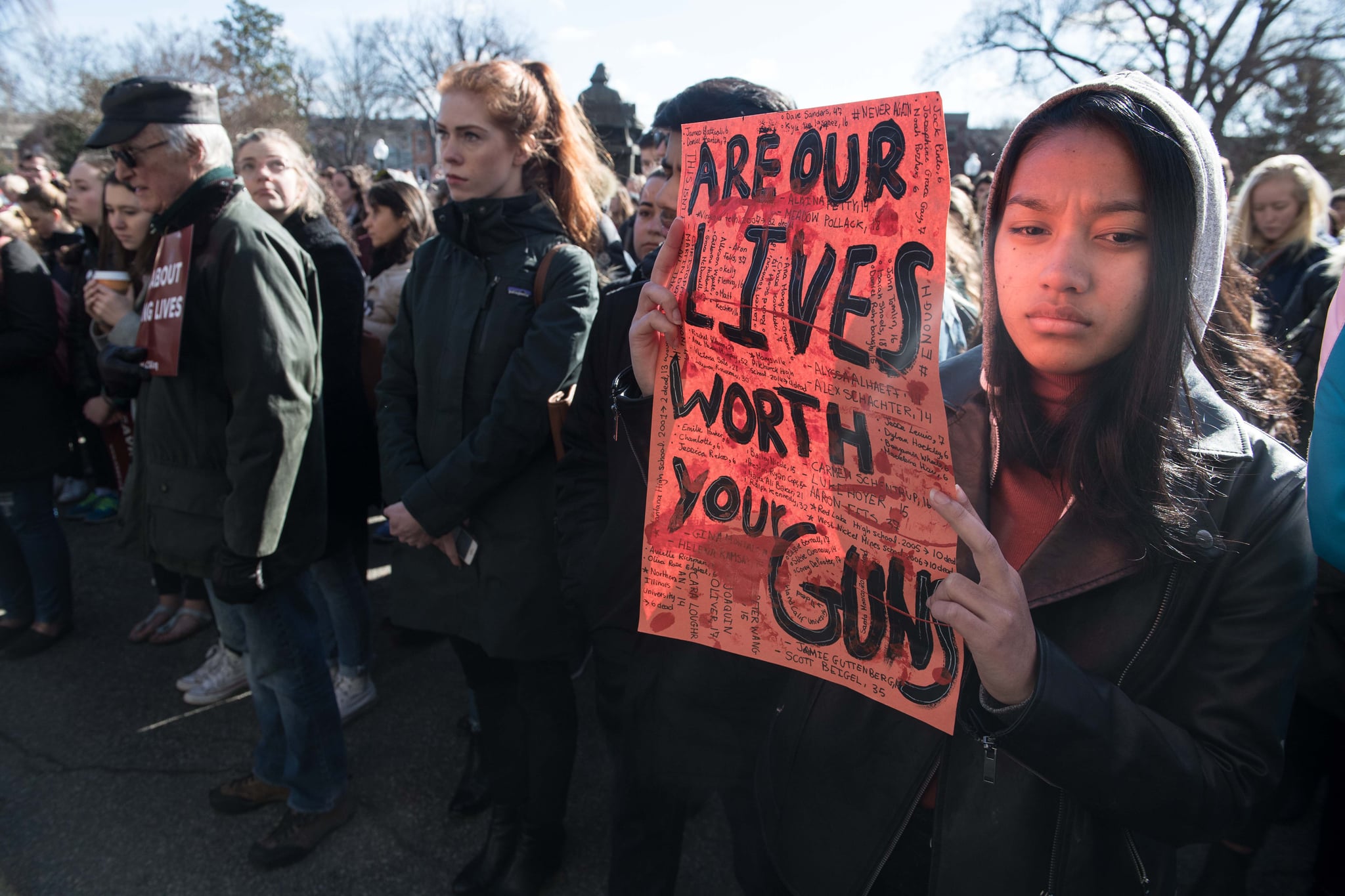 TOPSHOT - A student holds a sign at Georgetown University in Washington, DC, on March 14, 2018 during a national walkout to protest gun violence, one month after the school shooting in Parkland, Florida, in which 17 people were killed. / AFP PHOTO / NICHOLAS KAMM        (Photo credit should read NICHOLAS KAMM/AFP/Getty Images) *** BESTPIX ***
