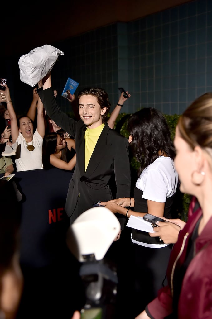 Watch Timothée Chalamet Hand Out Bagels at The King Premiere