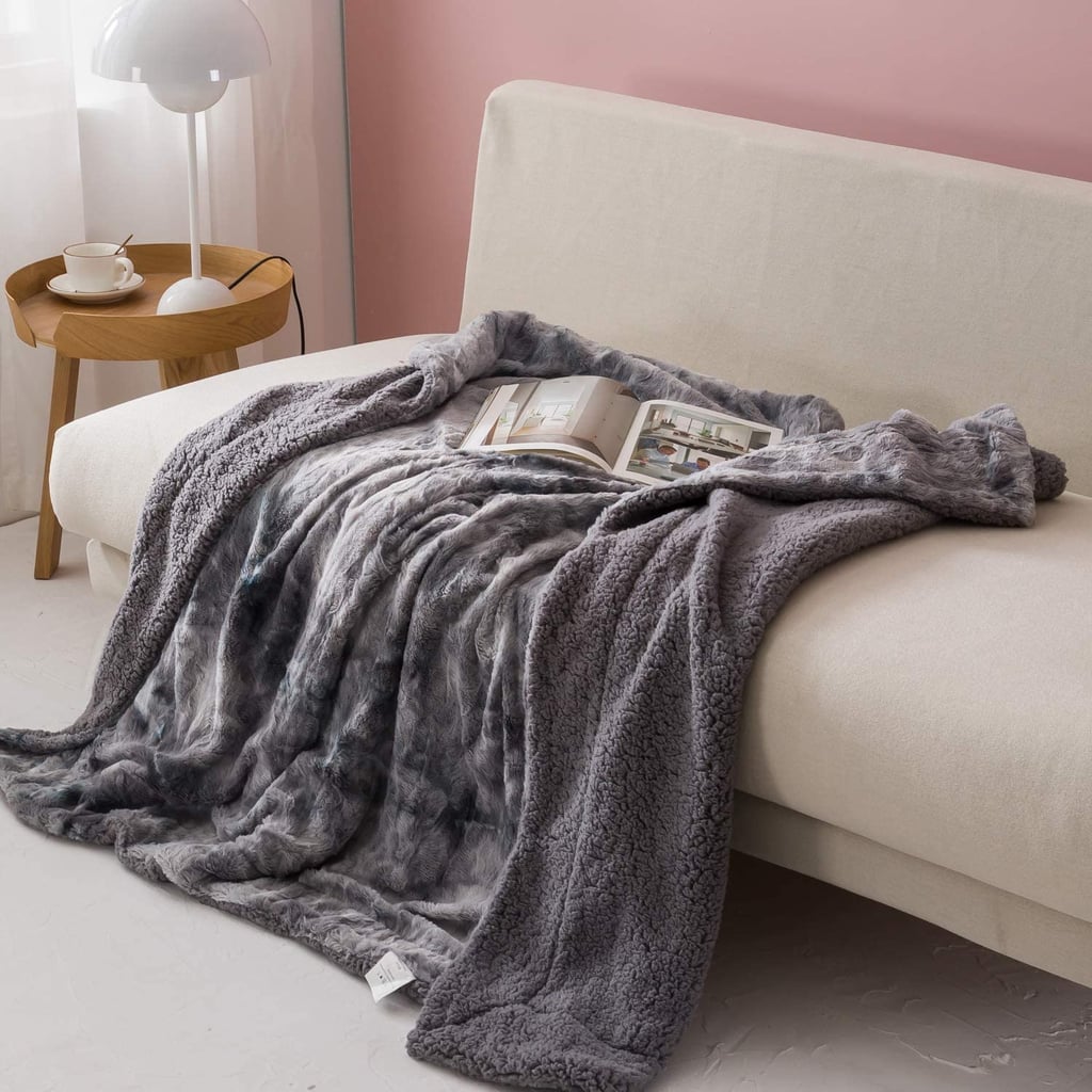 For Staying Warm and Cosy: Newcosplay Super Soft Faux Fur Throw Blanket