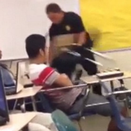 Officer Removing a Female High School Student From Class