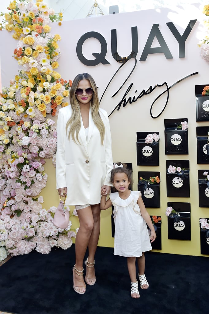 Chrissy Teigen, John Legend, and Luna at Quay Event | Photos