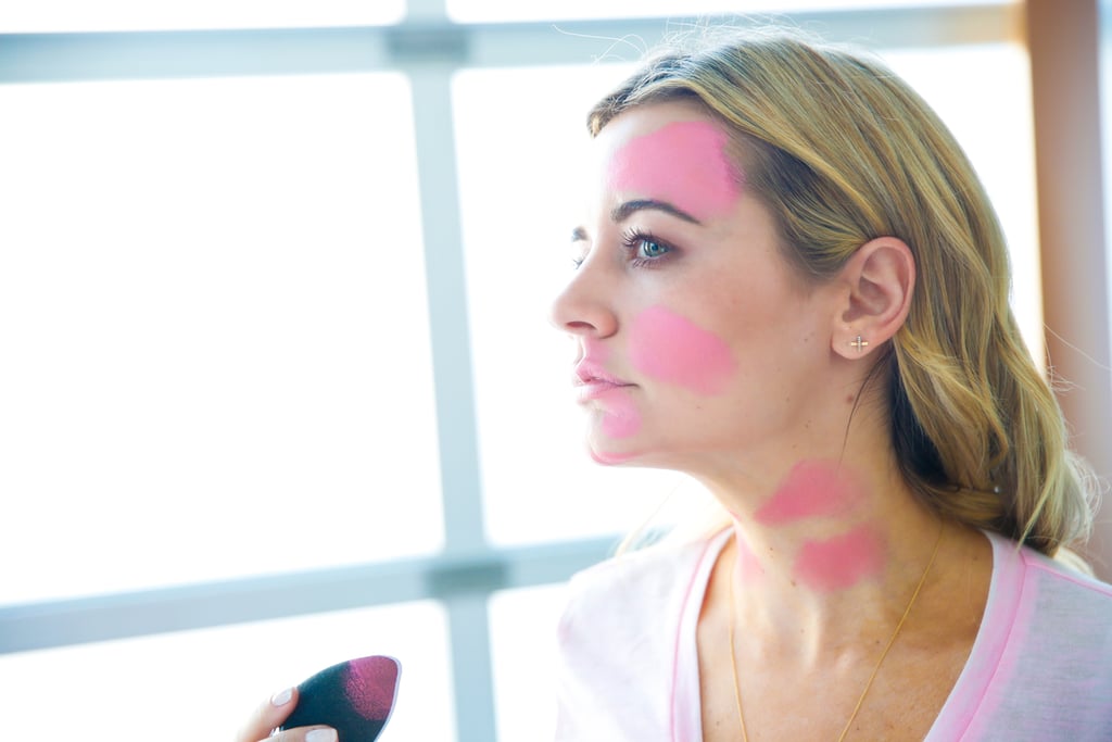 Apply pink to the right side of your forehead, right above your brow to the hairline, on your right cheek, and then on the left cheek up to the temple, to your nose, ending at the corner of your mouth. 
Make spots on your lips, chin, and jawline, then create "bones" on your neck. The only spots in this makeup look that need to be perfect are your neck bones. The rest of the paint can be placed wherever you like, but I tried to copy the mural as close as possible.