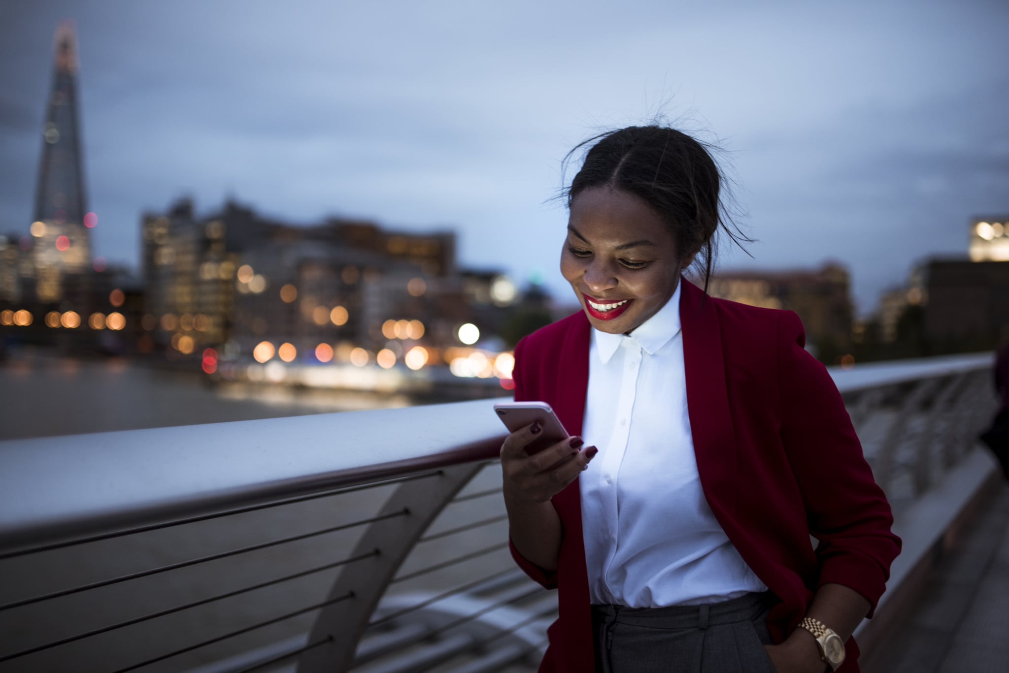 Front view photo of a woman using digital tablet in London