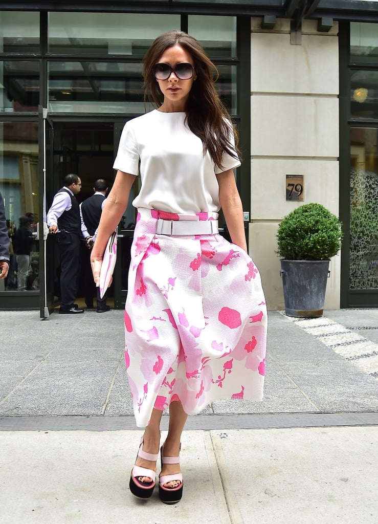 Wearing a pink printed midi skirt from her own collection in June 2015.