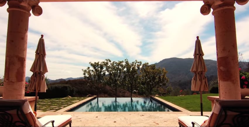 The infinity pool is poised over the mountains.