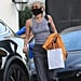 Miley Cyrus Wears a Gray Tank Top and Trousers