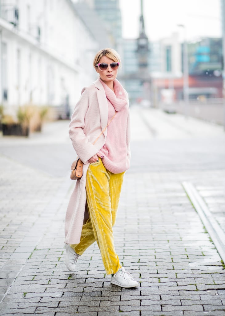 With a Pink Jumper, Yellow Velvet Trousers, and a Light Pink Coat