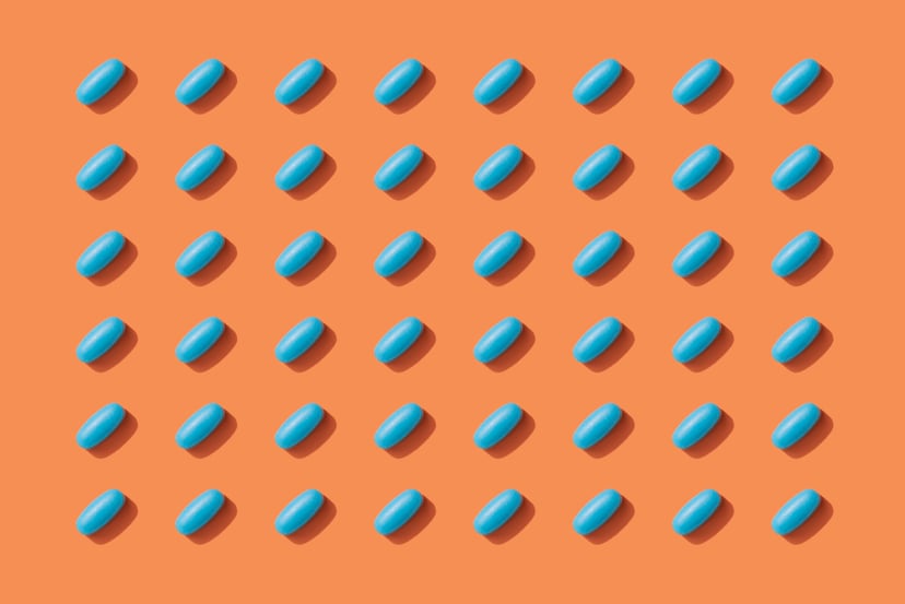 Repeated Pills on Orange Color Background