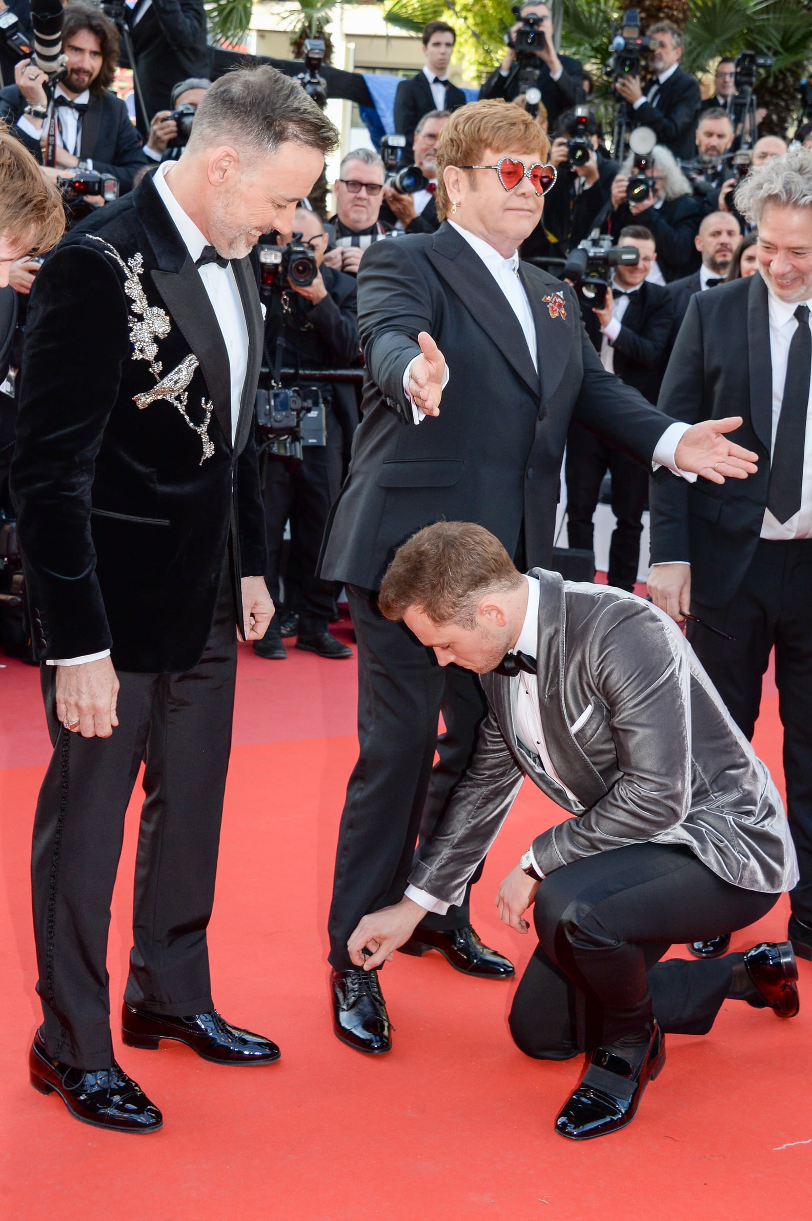 Taron Egerton Tying Elton John's Shoe Cannes Film Festival PS Celebrity(01)