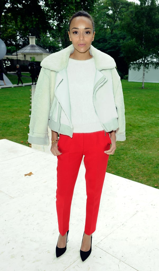 At the Topshop Unique show during London Fashion Week Spring/Summer 2014, Ashley Madekwe balanced her bright red trousers with a neutral blouse and coordinating shearling jacket.
Where to Wear: A concert.