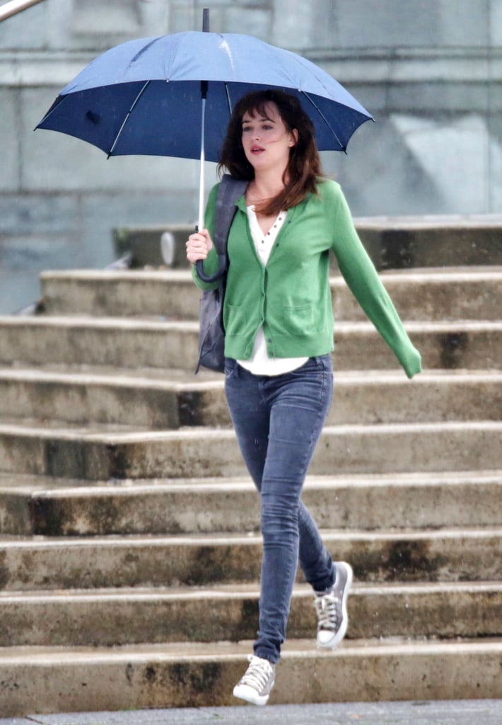 Dakota Johnson braved the rain in Vancouver, British Columbia, Canada, while filming reshoots for Fifty Shades of Grey on Monday.